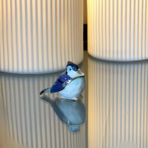 Image of round blue bird trinket box open
